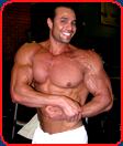 bodybuilder mustafa khater side chest pose flex smiling
