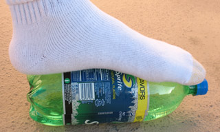giant foot sock on sprite bottle