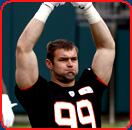 football player margus hunt arms raised biceps