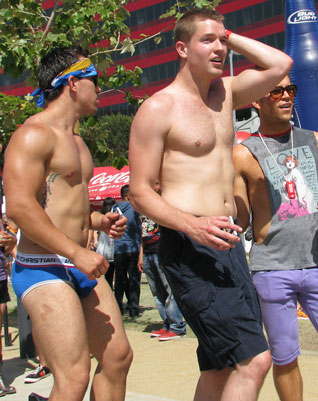 tall man gay pride parade short bodybuilder