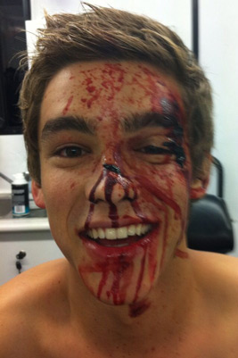 brenton thwaites bloody face makeup smiling