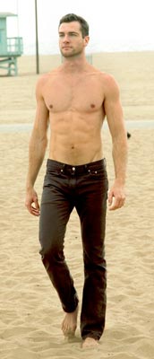 tall male model shirtless beach sand