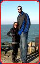 giant man with girlfriend by ocean