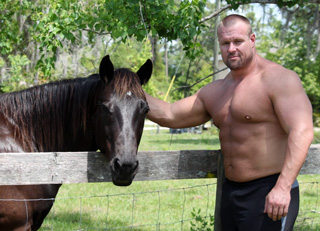 bodybuilder gigantic gary dwarfs full grown horse