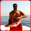 bodybuilder tourist catches saltwater fish