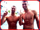 two shirtles athletes swimming meet